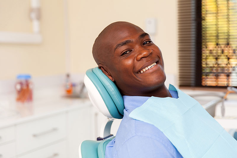 African man visiting dentist for dental checkup