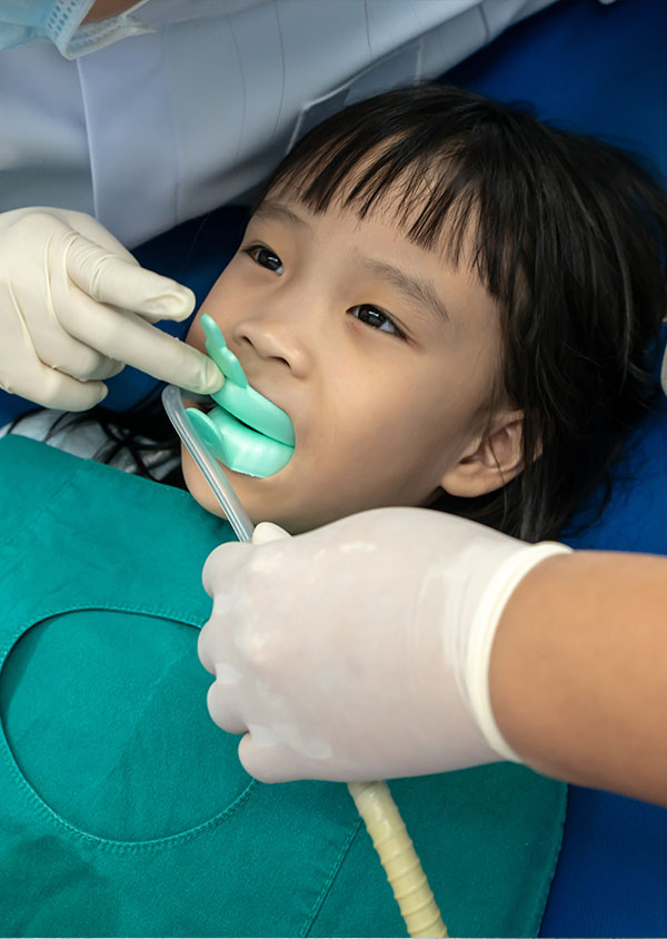 A child receives Fluoride Treatments